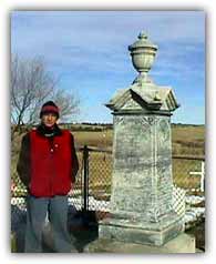 Nick at the headstone of the mass gravesite at Wounded Knee