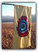 The Cherokee flag waving above the sacred mounds