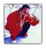 A gang member of the Bloods throw's up his gang signs.